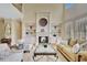 Elegant living room with fireplace, built-in shelving, and comfortable seating at 105 New Castle Ln, Tyrone, GA 30290