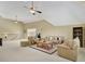 Spacious living room with plush seating, a ceiling fan, and great natural light at 105 New Castle Ln, Tyrone, GA 30290
