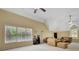 Large living room with high ceilings, big windows, and comfortable seating at 105 New Castle Ln, Tyrone, GA 30290