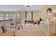 Open loft area with a desk, chairs, and natural light at 105 New Castle Ln, Tyrone, GA 30290