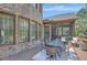 Covered deck with outdoor seating, providing a comfortable space for dining and relaxing at 105 New Castle Ln, Tyrone, GA 30290