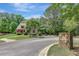 Street view of a charming home in 'The Club' neighborhood with manicured lawn at 105 New Castle Ln, Tyrone, GA 30290