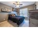 Comfortable bedroom decorated with sports memorabilia and a ceiling fan at 1215 Smoke Hill Ln, Hoschton, GA 30548