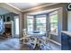 Cozy breakfast nook with a fireplace and an abundance of natural light at 1215 Smoke Hill Ln, Hoschton, GA 30548