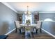 Comfortable dining area features a round table, stylish seating, and coordinated decor for a cozy atmosphere at 1215 Smoke Hill Ln, Hoschton, GA 30548