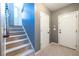 Hallway featuring neutral paint, carpet and two doors, one to the outside and one to a closet at 1215 Smoke Hill Ln, Hoschton, GA 30548