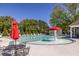 Resort-style pool area featuring a splash fountain and comfortable lounge seating at 1215 Smoke Hill Ln, Hoschton, GA 30548