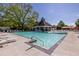 Community pool with clear water, comfortable lounge chairs, and a shaded pavilion at 1215 Smoke Hill Ln, Hoschton, GA 30548