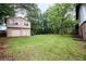 Large, grassy backyard with detached garage and upper apartment at 382 Plantation Blvd, Lawrenceville, GA 30046