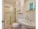 This bathroom features a shower, toilet, sink, medicine cabinet, and neutral color palette at 382 Plantation Blvd, Lawrenceville, GA 30046