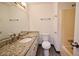 Bathroom with a granite countertop vanity and a shower-tub combo at 382 Plantation Blvd, Lawrenceville, GA 30046