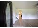 Bright entryway featuring light wood floors and a view of the kitchen at 382 Plantation Blvd, Lawrenceville, GA 30046