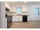 Clean kitchen with updated countertops, white cabinetry, and stainless steel appliances at 382 Plantation Blvd, Lawrenceville, GA 30046