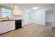 Bright and clean kitchen with white cabinets, granite countertops, and a window view at 382 Plantation Blvd, Lawrenceville, GA 30046