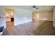 Open living room featuring light wood floors and views of the adjacent rooms at 382 Plantation Blvd, Lawrenceville, GA 30046