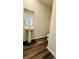 Powder room with pedestal sink, large mirror, and dark wood flooring at 4495 Buttonwood Ln, Lilburn, GA 30047