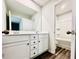 Bathroom with a double sink vanity, large mirror, and bath/shower combination at 4495 Buttonwood Ln, Lilburn, GA 30047