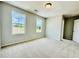 Spacious bedroom with large windows and plush carpeting that lets in tons of natural light at 4495 Buttonwood Ln, Lilburn, GA 30047