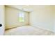 Bedroom featuring a window, neutral carpet, and freshly painted walls at 4495 Buttonwood Ln, Lilburn, GA 30047