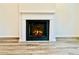 Elegant fireplace with white mantle and hearth and a cozy gas insert at 4495 Buttonwood Ln, Lilburn, GA 30047
