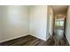 Hallway featuring dark wood flooring and light neutral-colored walls at 4495 Buttonwood Ln, Lilburn, GA 30047
