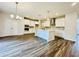 Spacious kitchen with white cabinets, stainless steel appliances and a large center island at 4495 Buttonwood Ln, Lilburn, GA 30047