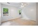 Neutral bedroom with carpet, natural lighting from two windows, and ample open space at 6800 Wright Rd, Atlanta, GA 30328