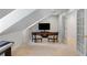 Cozy bonus room with plush carpeting, entertainment center, and ample seating for relaxation and media enjoyment at 6800 Wright Rd, Atlanta, GA 30328
