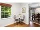 Cozy breakfast nook with hardwood floors, natural light, and seating for two, perfect for enjoying morning coffee at 6800 Wright Rd, Atlanta, GA 30328