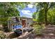 The home's exterior features a patio area, brick chimney, and lush landscaping at 6800 Wright Rd, Atlanta, GA 30328
