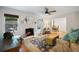 Cozy living room featuring hardwood floors, fireplace, and comfortable seating with ample natural light at 6800 Wright Rd, Atlanta, GA 30328