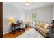 Cozy office area with a desk, sofa, and natural lighting, perfect for a home workspace at 6800 Wright Rd, Atlanta, GA 30328