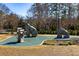 Artistic stone sculptures and a safety-conscious, cushioned ground in play area at 6800 Wright Rd, Atlanta, GA 30328