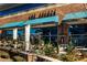 Exterior view of The Select Restaurant and Bar with patio seating and awnings at 6800 Wright Rd, Atlanta, GA 30328