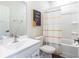 Clean bathroom featuring a white vanity and a tub with a colorful shower curtain at 135 Climbing Ivy Cir, Fayetteville, GA 30214