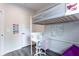 Functional bedroom showcasing a loft bed with a built-in desk and ample space at 135 Climbing Ivy Cir, Fayetteville, GA 30214