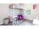 Stylish bedroom with a loft bed, desk area, and vibrant decor at 135 Climbing Ivy Cir, Fayetteville, GA 30214