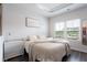 Cozy bedroom featuring natural light, soft neutral color palette, and a comfortable ambiance at 135 Climbing Ivy Cir, Fayetteville, GA 30214