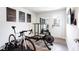 Well-lit exercise room featuring modern workout equipment, motivational art, and a mirrored wall at 135 Climbing Ivy Cir, Fayetteville, GA 30214