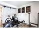 Bright exercise room featuring modern equipment, sleek barn door, and motivational wall art at 135 Climbing Ivy Cir, Fayetteville, GA 30214