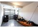 Spacious garage with epoxy flooring, storage solutions and ample room for vehicles and gear at 135 Climbing Ivy Cir, Fayetteville, GA 30214