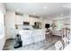 Contemporary kitchen with white cabinets, stainless steel appliances, and a large center island at 135 Climbing Ivy Cir, Fayetteville, GA 30214