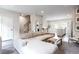 Open-concept living space with a large sofa, modern decor, and seamless transition to the kitchen area at 135 Climbing Ivy Cir, Fayetteville, GA 30214