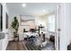 Home office filled with natural light, featuring a modern adjustable desk and decor at 135 Climbing Ivy Cir, Fayetteville, GA 30214