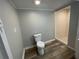 Bathroom featuring a toilet and a separate shower stall with white tile at 1440 Kenilworth Sw Dr, Atlanta, GA 30310
