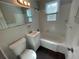 Bathroom featuring a classic white sink, toilet and bathtub at 1440 Kenilworth Sw Dr, Atlanta, GA 30310