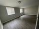 Bright and airy bedroom with wood floors and large windows that bring in plenty of natural light at 1440 Kenilworth Sw Dr, Atlanta, GA 30310