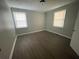 Bedroom featuring new flooring and natural light from the windows at 1440 Kenilworth Sw Dr, Atlanta, GA 30310