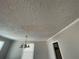 Textured ceiling with a hanging light fixture at 1440 Kenilworth Sw Dr, Atlanta, GA 30310