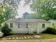 Charming single-story home featuring a traditional design and a well-maintained front yard at 1440 Kenilworth Sw Dr, Atlanta, GA 30310